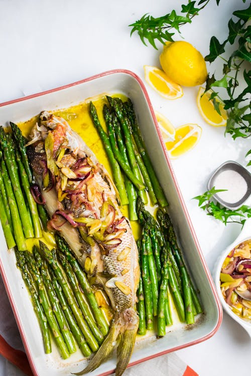 Baked snapper with onions and asparagus