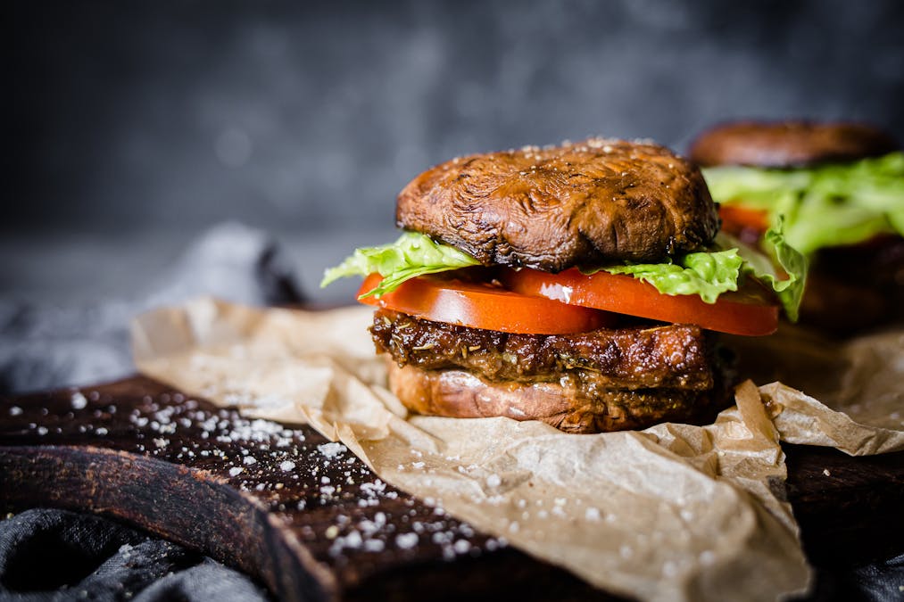 Low-carb vegan tempeh burger with portobello bun