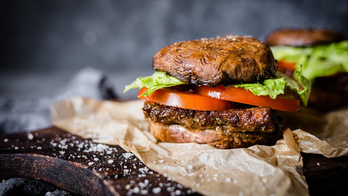 Low-carb vegan tempeh burger with portobello bun