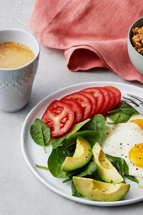 Simple liberal low carb breakfast with fried eggs and yogurt