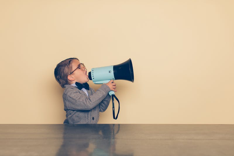 Young Nerd Boy Yells into Megaphone