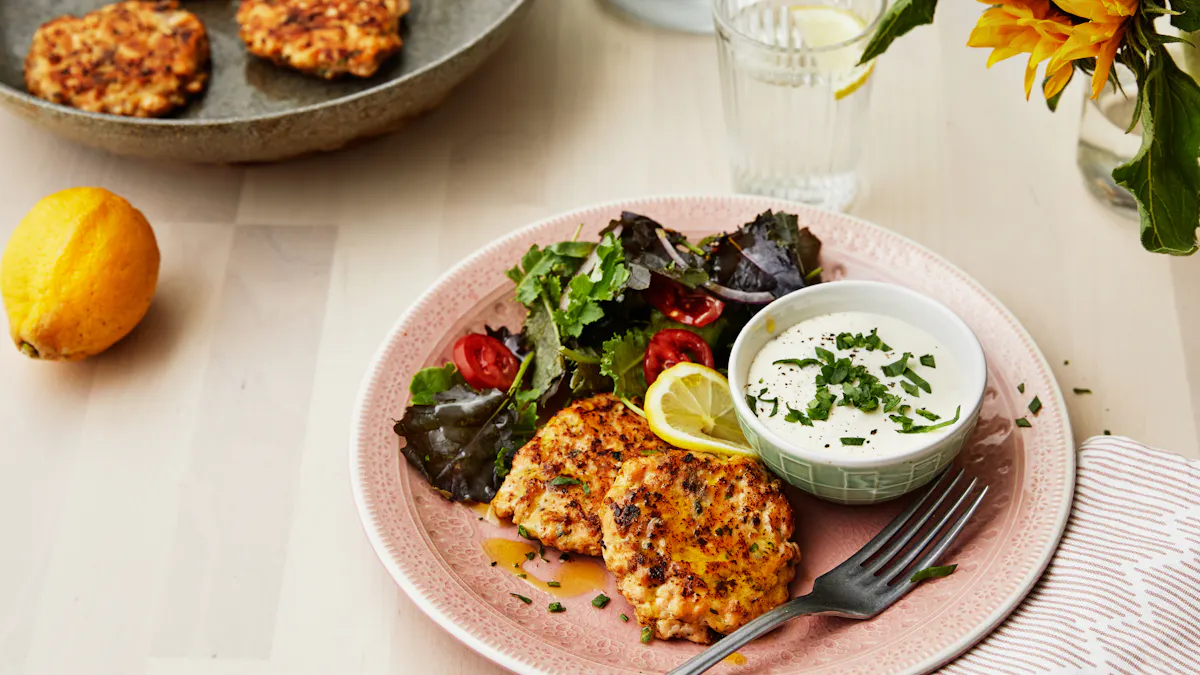 Salmon patties with feta cheese sauce