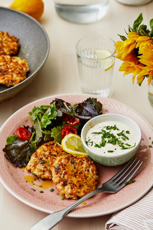Salmon patties with feta cheese sauce