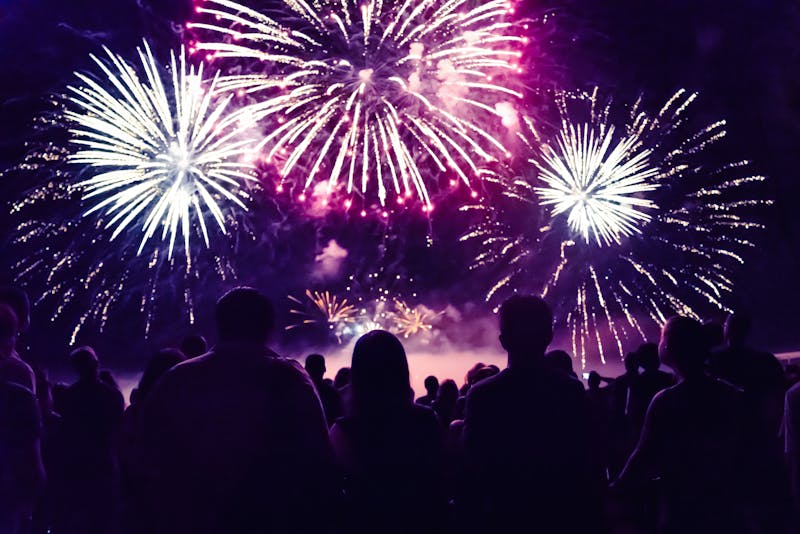 Crowd watching fireworks and celebrating new year eve