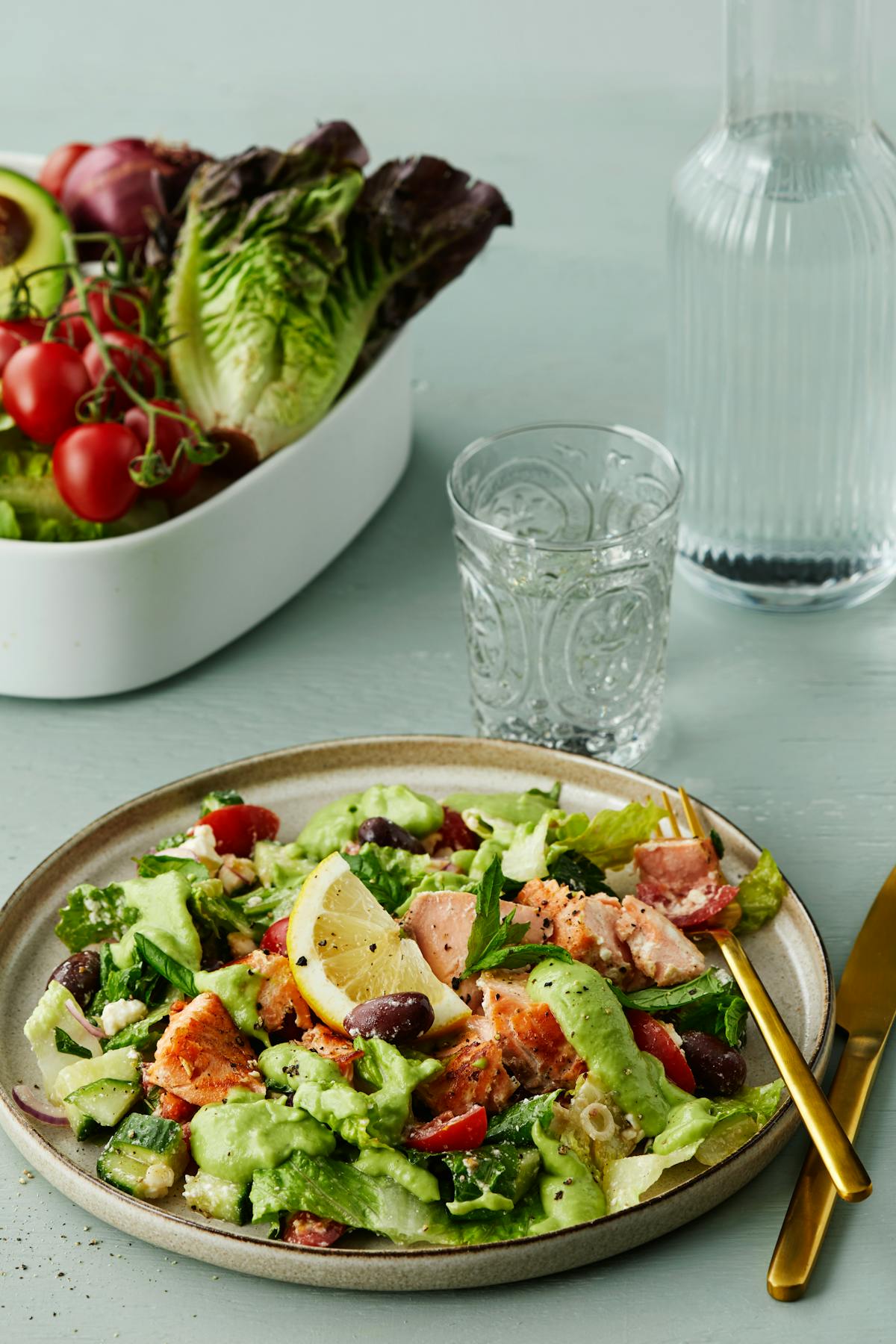 Salmon salad with feta cheese and avocado dressing