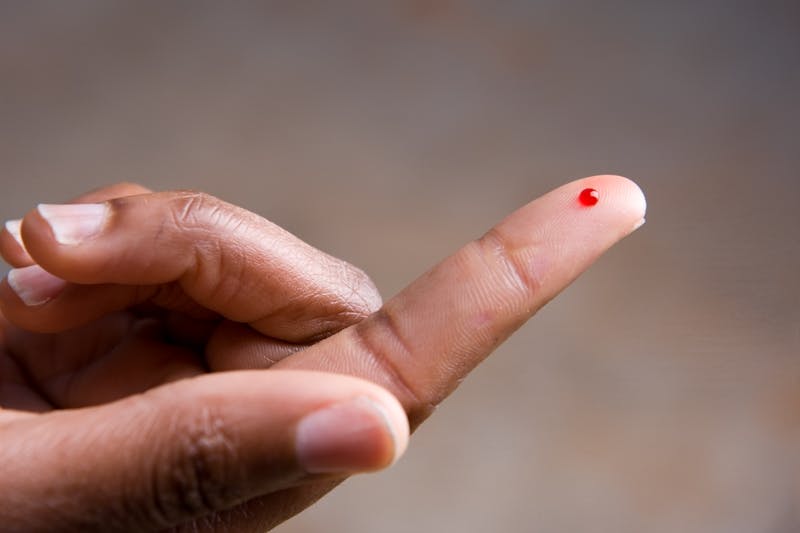Drop of blood on fingertip for a medical exam