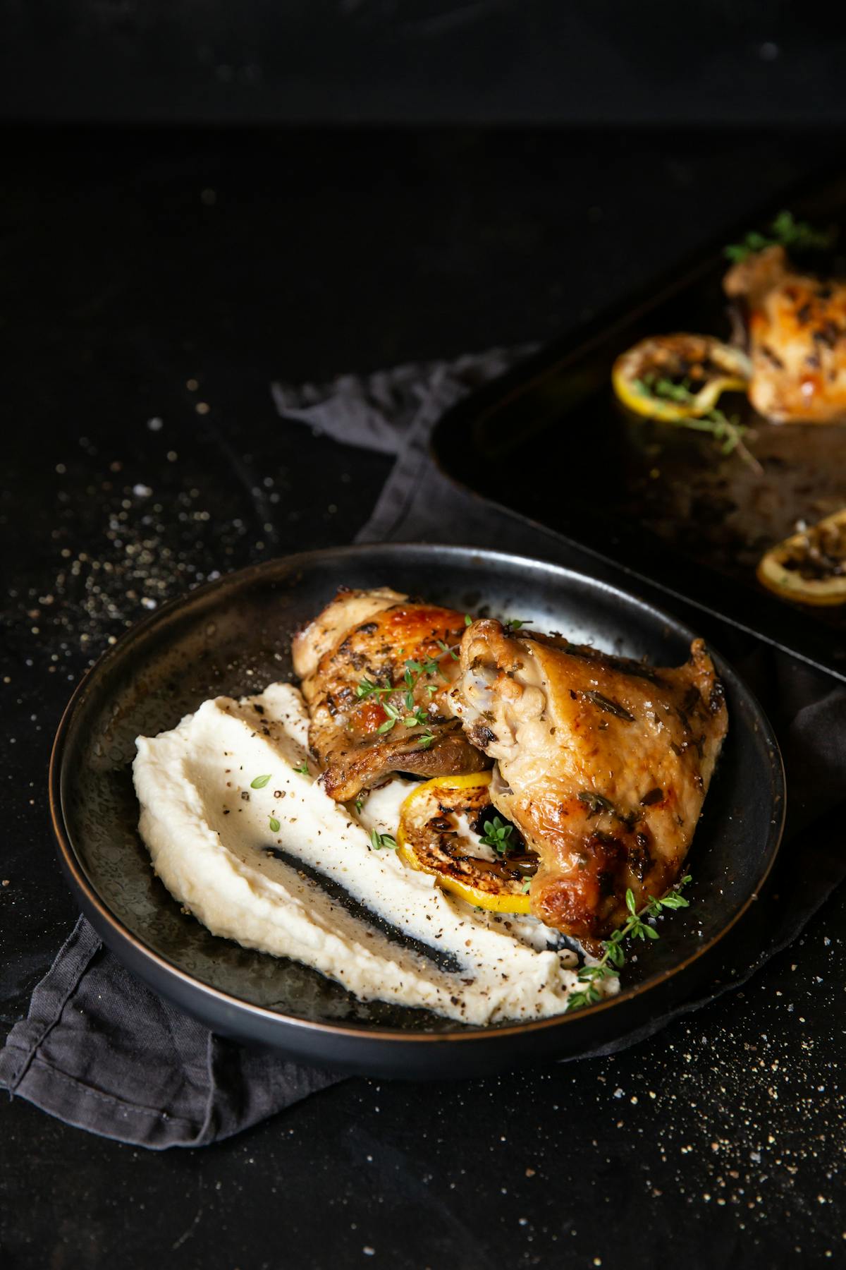 Lemon-baked chicken thighs with cauliflower mash