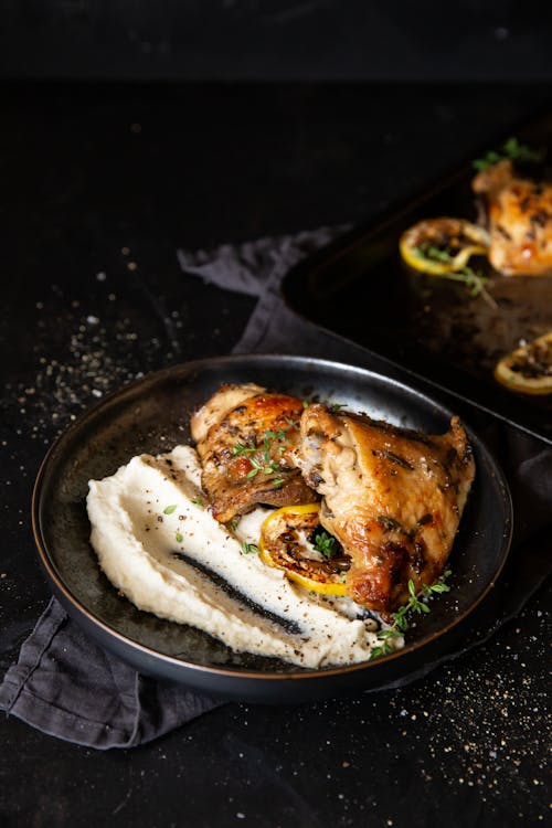 Lemon-baked chicken thighs with cauliflower mash