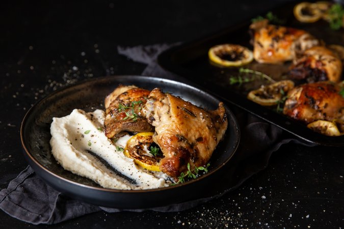Lemon-baked chicken thighs with cauliflower mash