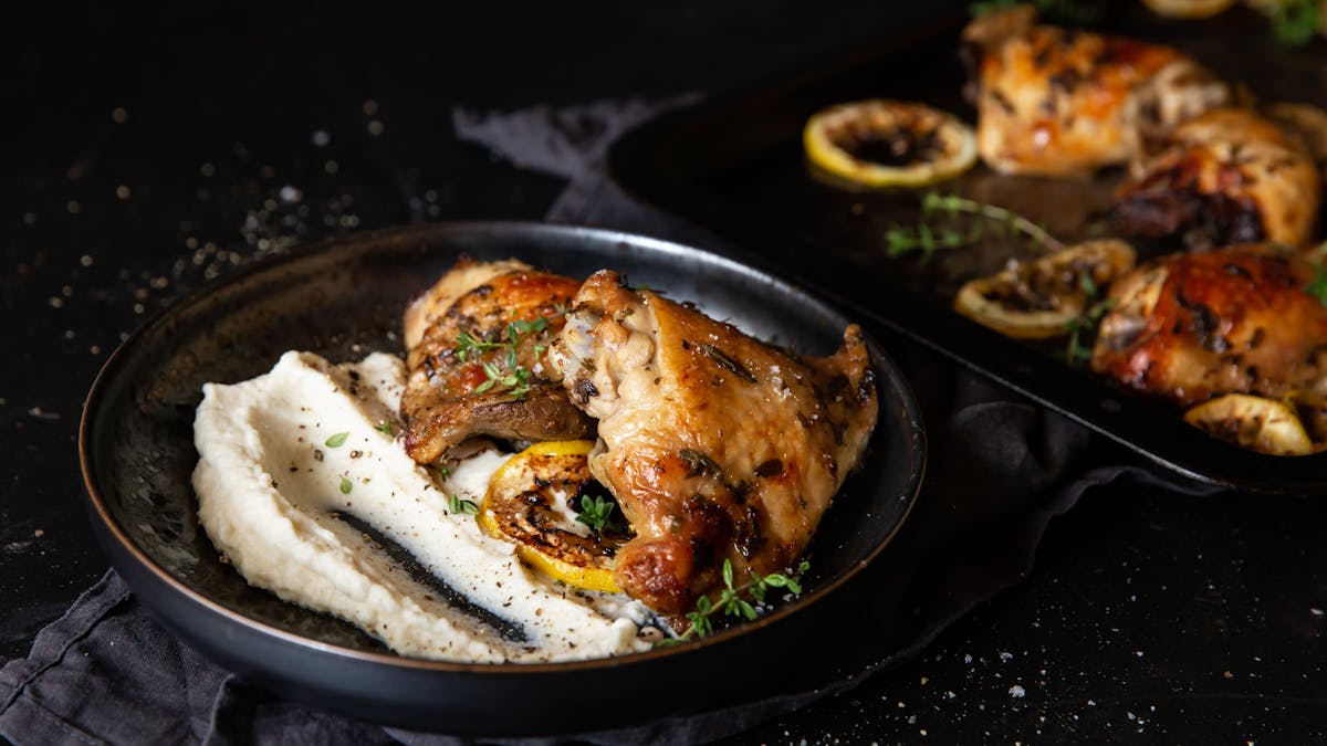 Lemon-baked chicken thighs with cauliflower mash