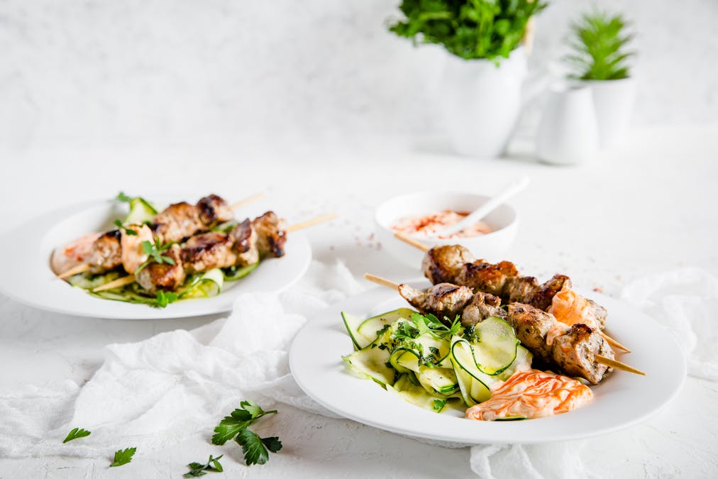 Grilled pork skewers with ribbon zoodles
