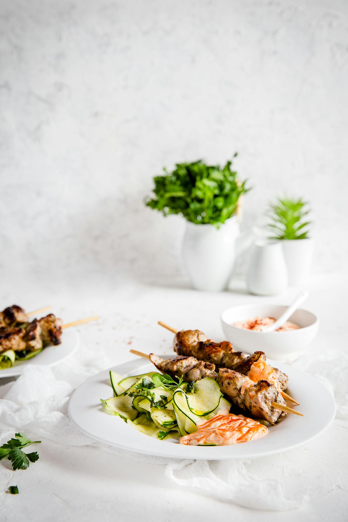 Grilled pork skewers with ribbon zoodles