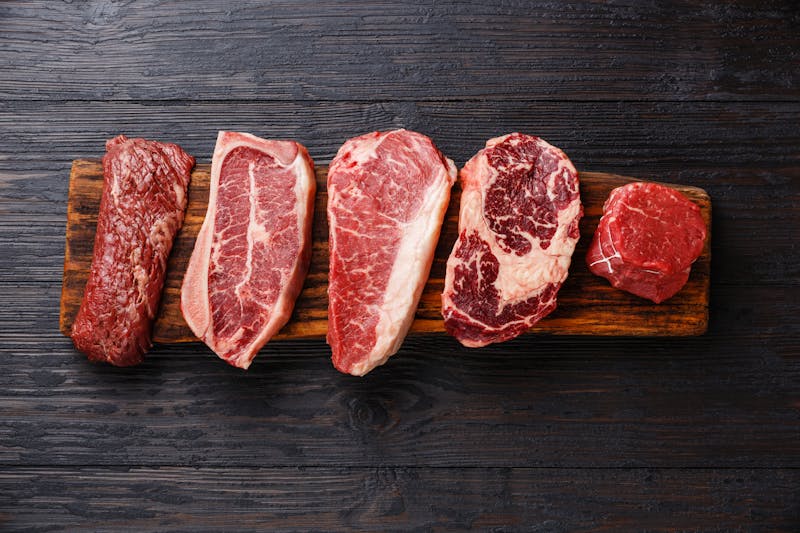 Variety of Raw Black Angus Prime meat steaks