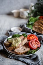 Keto Italian meatloaf with baked tomatoes and pesto mayo