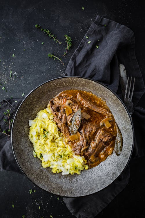 Slow-cooked braised beef with buttery herb cabbage
