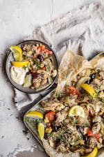 Greek chicken sheet-pan meal with garlic sauce