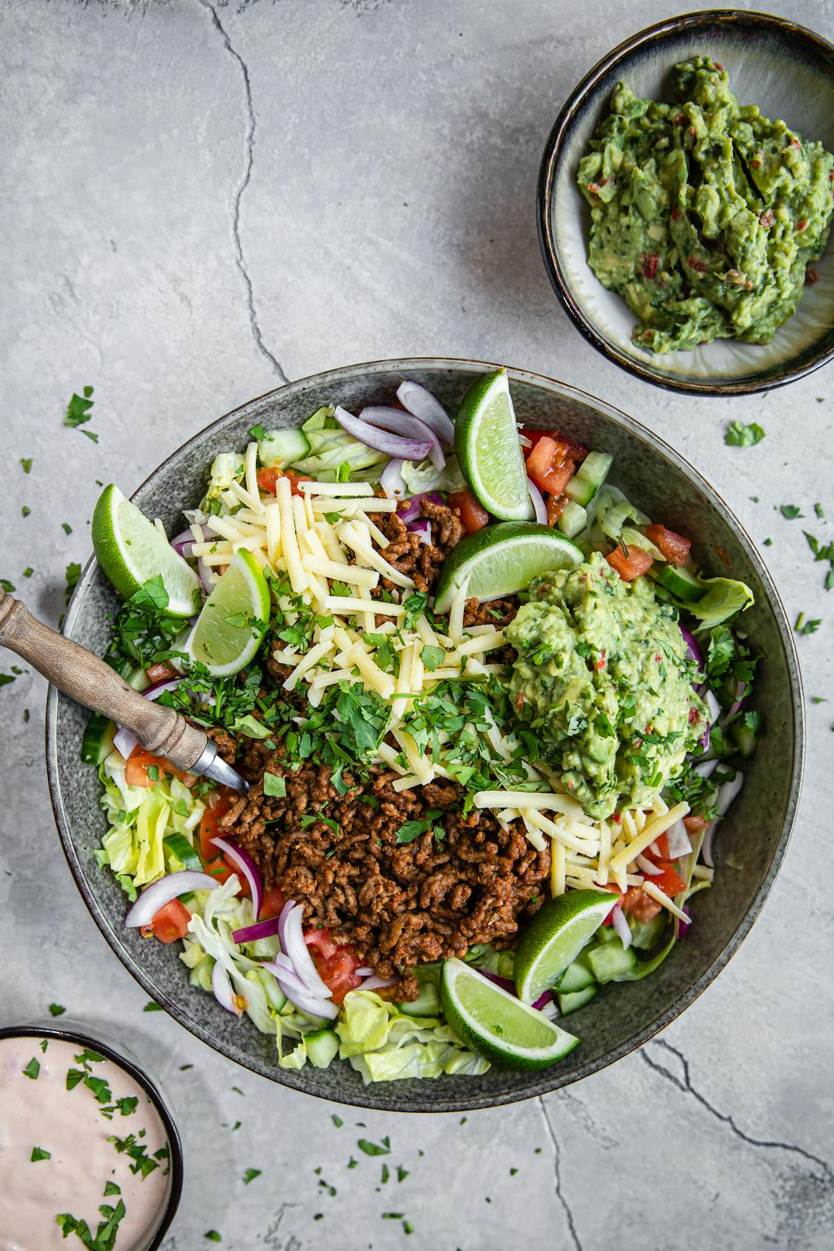 Keto taco salad with salsa dressing and guacamole