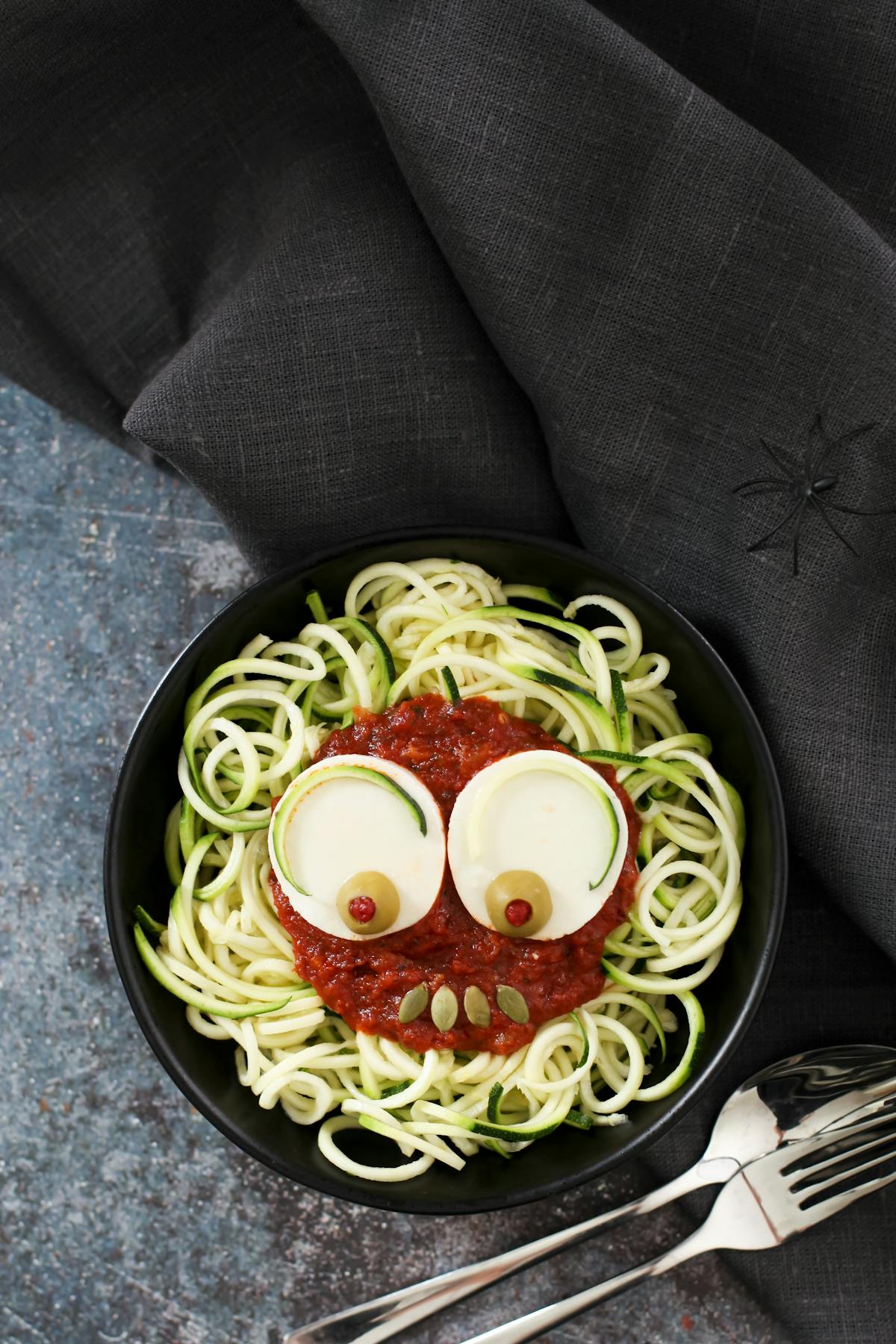 Spooky zoodles with tomato sauce and mozzarella