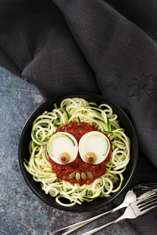 Spooky zoodles with tomato sauce and mozzarella