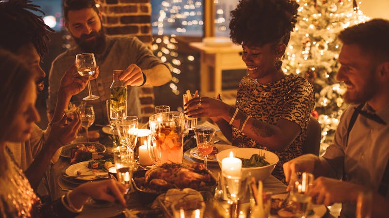 Cozy New year dinner among friends
