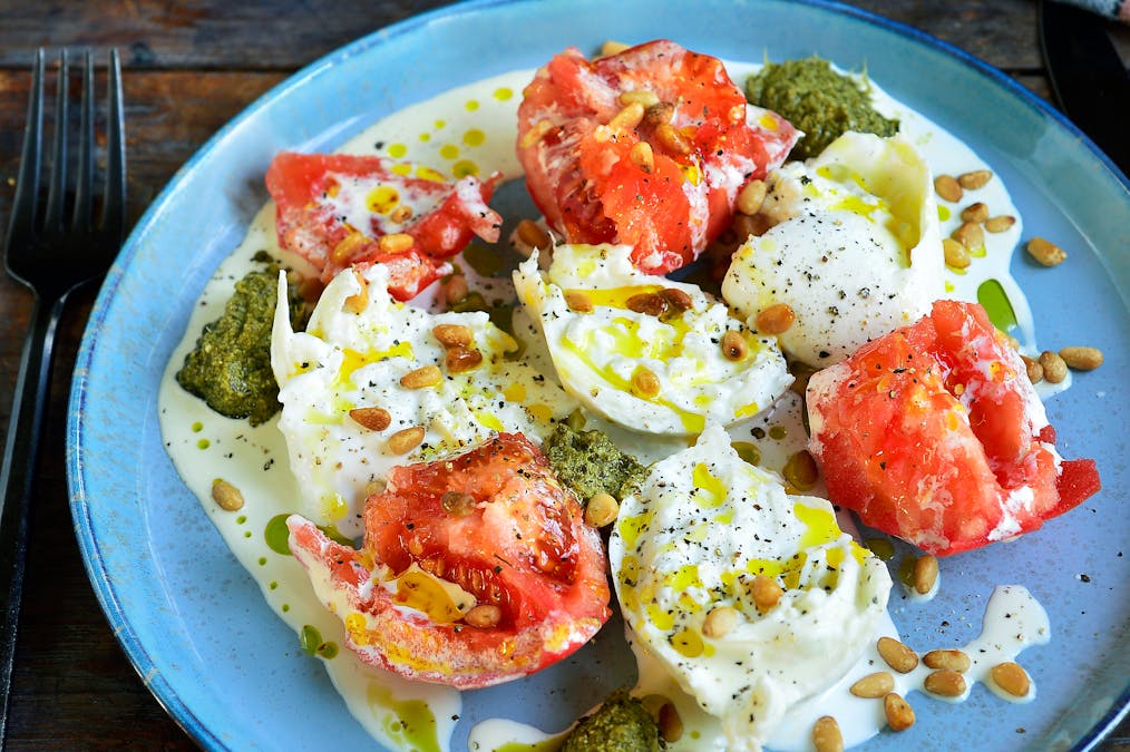 Burrata with tomato, cream and pesto