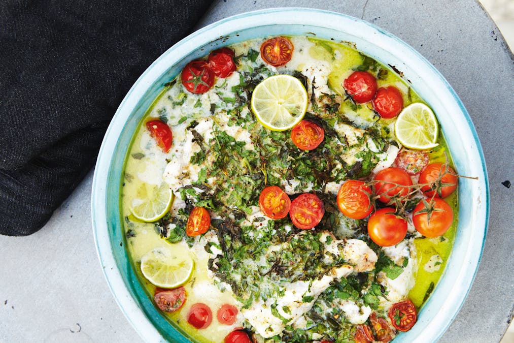 White fish with herbs, coconut milk, lime, and tomatoes