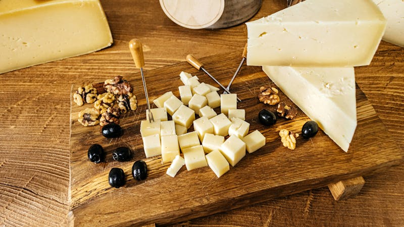 Composition of cheese cubes on a wooden table