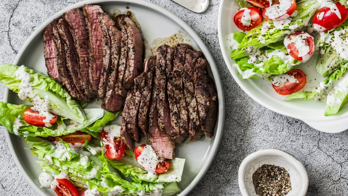 Beef medium rare steak and romaine salad cherry tomatoes <a href=