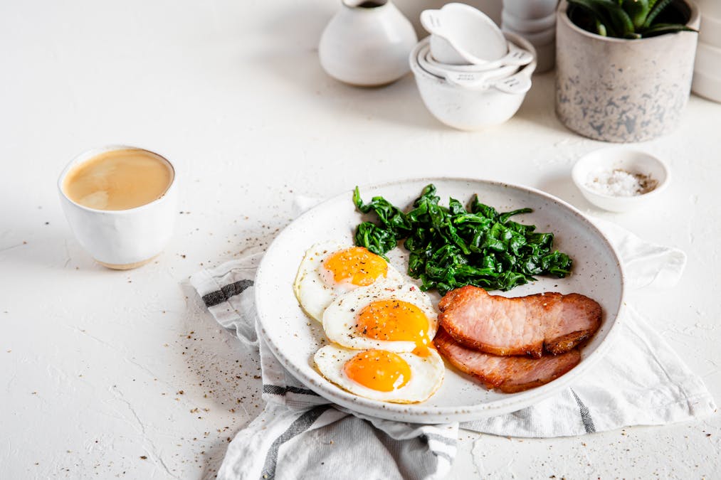 High protein breakfast with Canadian bacon, eggs, and spinach