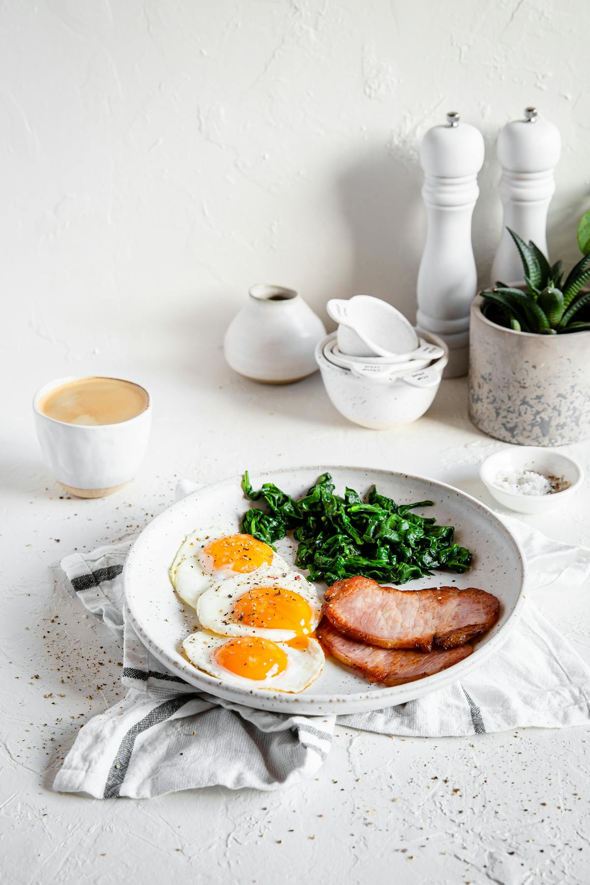 High protein breakfast with Canadian bacon, eggs, and spinach