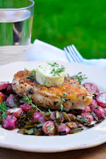 Oven-baked chicken breast and radishes with thyme butter