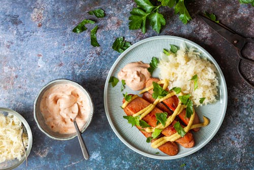 High protein sausage with sauerkraut and yellow mustard