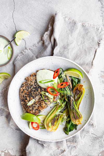 Sesame-crusted tuna steaks with wasabi mayo and bok choy