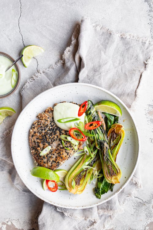 Sesame-crusted tuna steaks with wasabi mayo and bok choy