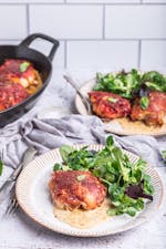 Prosciutto-wrapped chicken thighs with garlic cream sauce