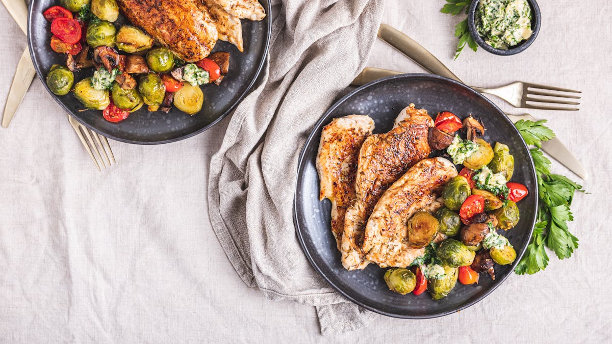 Chicken breast with roasted vegetables and garlic butter