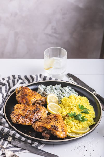 Baked chicken thighs with cauliflower rice and spinach dip