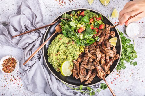 Mexican steak strips with salad and guacamole