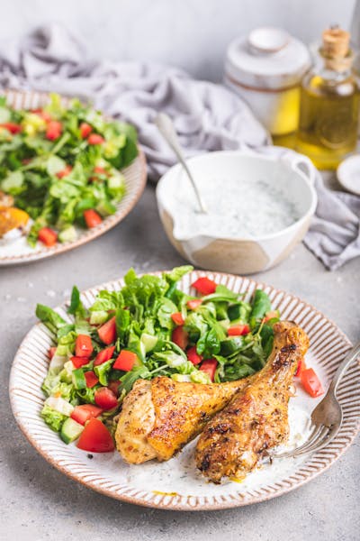 Roasted drumsticks with salad and tzatziki