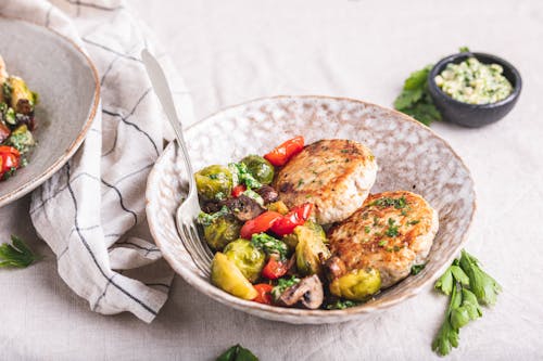 Turkey burger with roasted vegetables and garlic butter