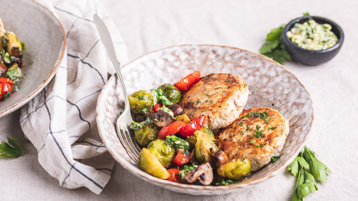 Turkey burger with roasted vegetables and garlic butter