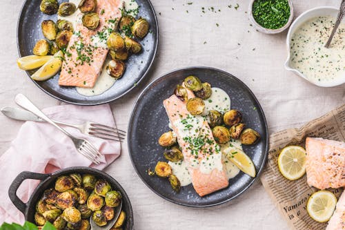 Baked salmon with horseradish cream sauce and roasted Brussels sprouts