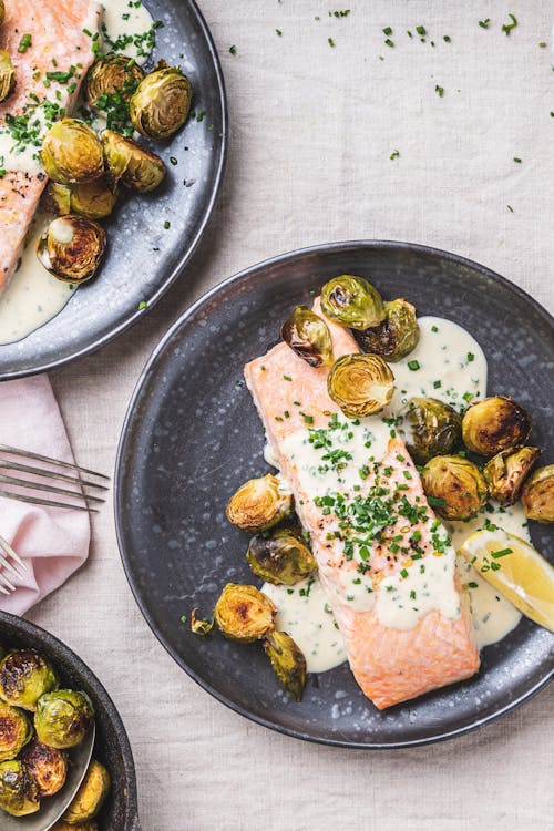 Baked salmon with horseradish cream sauce and roasted Brussels sprouts