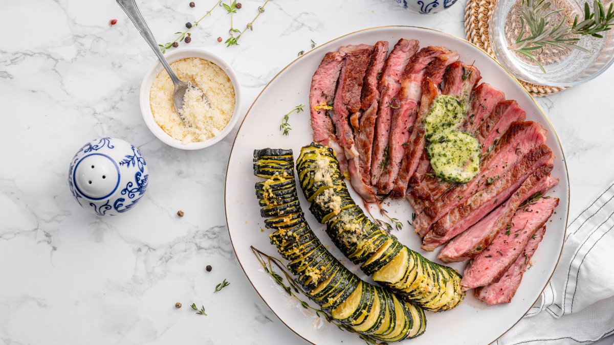 Ribeye with Hasselback zucchini and herb butter