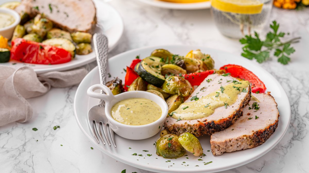 Pork tenderloin with roasted vegetables and pesto aioli