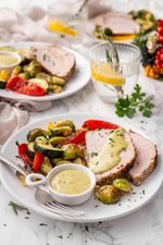 Pork tenderloin with roasted vegetables and pesto aioli