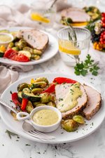 Pork tenderloin with roasted vegetables and pesto aioli