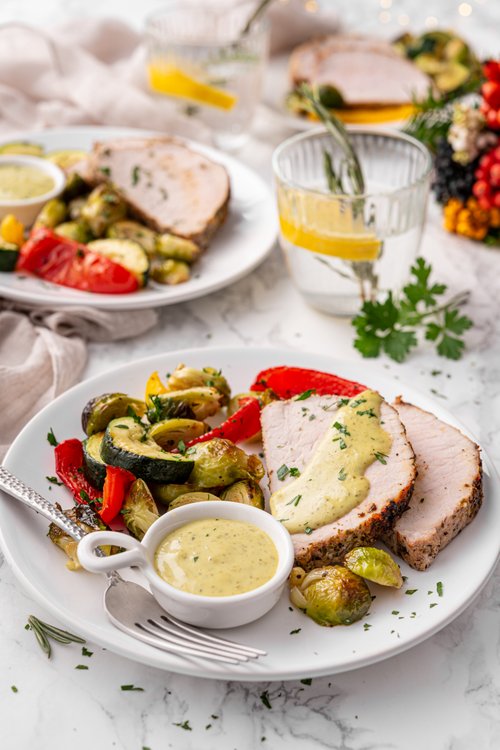 Pork tenderloin with roasted vegetables and pesto aioli